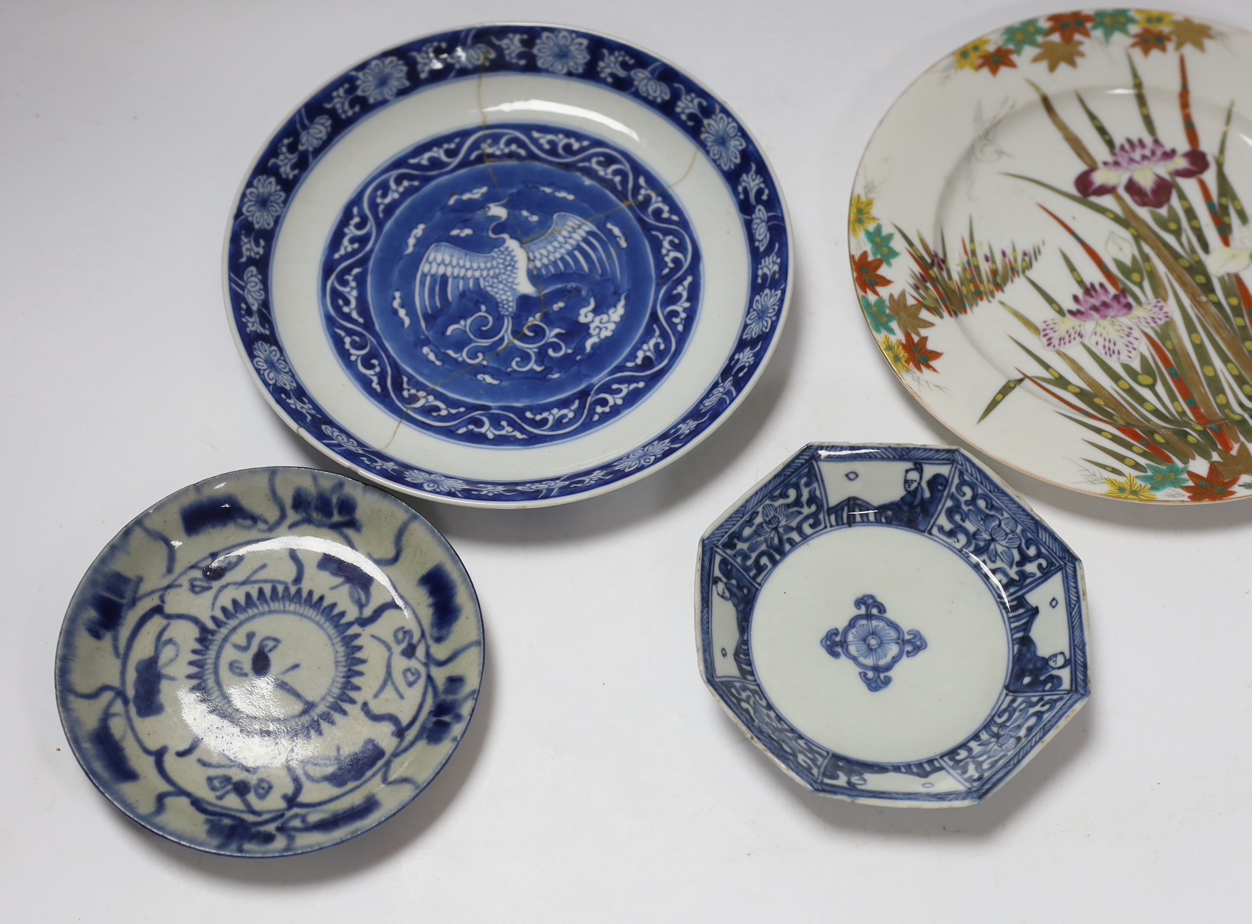 A group of 18th century Chinese porcelain plates and saucers, mostly blue and white and an octagonal famille rose example, together with three Japanese dishes, largest 27cm in diameter